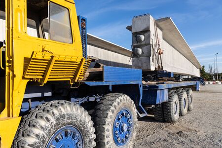 Truck transport pre-fabricated concrete beam to construct light rail transit infrastructure in...
