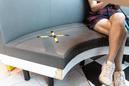 Seats marked with X prohibited with social distancing enforced to contain spreading of coronavirusの写真素材