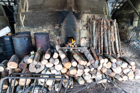KUALA SEPETANG, MALAYSIA, August 31st 2020: Traditional charcoal  factory with big kins that bakes mangrove logs into charcoalのeditorial素材