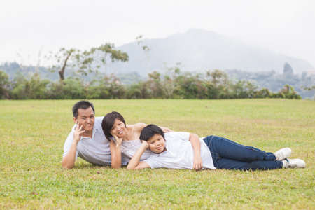 Asian family enjoying happy and joyful day out in outdoor natureの写真素材