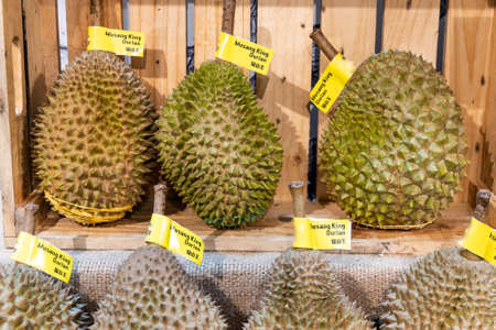 Popular Musang King Durian variety from Malaysia displayed in supermarket.  Chinese words is translation of Musang King in English.の写真素材
