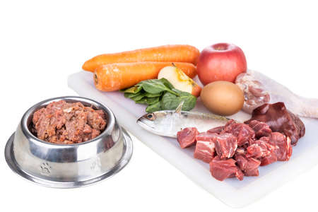MInced barf raw food recipe ingredient for dogs consisting meat, organs, fish, eggs and vegetable for good healthの写真素材
