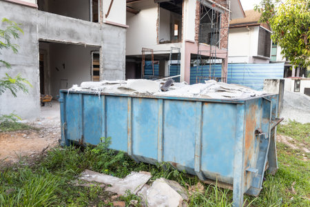 Garbage roro dumpter bin collects rubbish at construction siteの写真素材