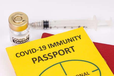 Concept of Covid-19 Immunity Passport for travel with vial and syringeの写真素材