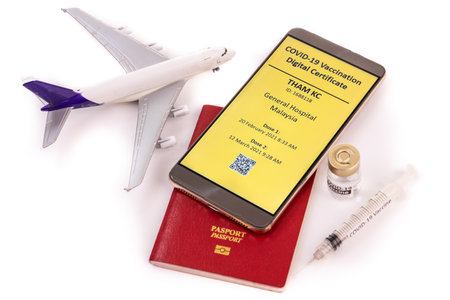 Concept of Covid-19 Immunity Passport for international travel, and digital certificte of vaccination on smart phone.の写真素材