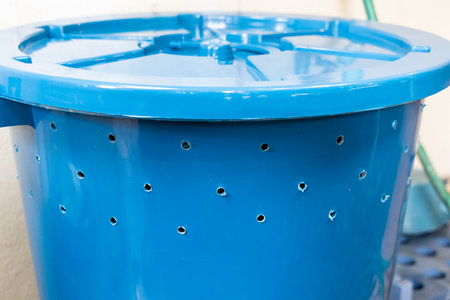 Bin with multiple holes drilled to be used to produce organic compost fertilizerの写真素材