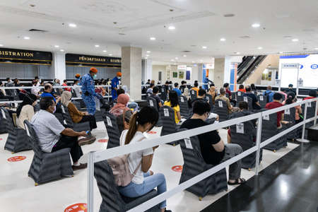 KUALA LUMPUR, MALAYSIA, July 16, 2021: People queing and waiting for their turn at World Trade Centre for their Covid-19 vaccine, under the national vaccination programのeditorial素材