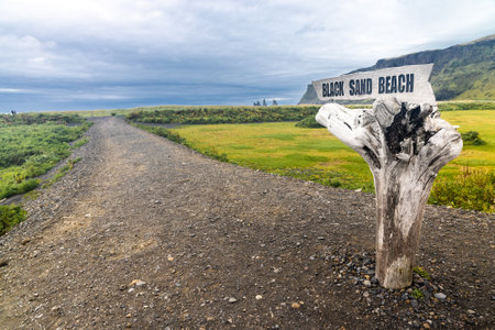 Signpost direction to Vik's scenic volcanic black sand beach in Iceland. Popular tourist destination connected through the ring roadの写真素材