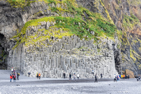 Reynisfjara Black Sand Beach Vik comes with scenic basalt columns and cliffs and is very popular tourist destination in Southern Icelandのeditorial素材