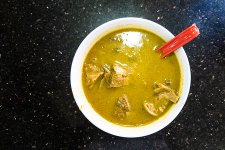 Overhead view of sup kambing, or mutton soup is a popular delicacy at mamak shop in Malaysiaの写真素材