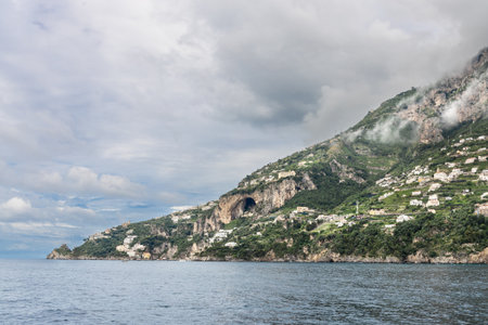 Scenic coastline of Almalfi Coast Italy with settlement on hills and cliffs. Popular tourist destination in Italy.の写真素材