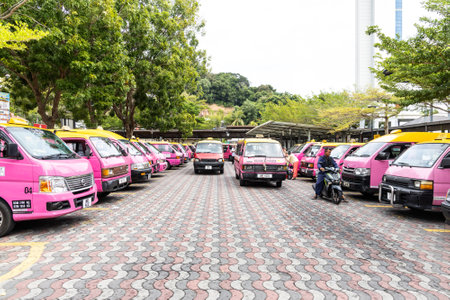 Pink vans are taxis in Pangkor Island and is unique and common mode of transportation for tourists exploring the islandのeditorial素材