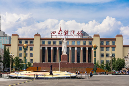 Sichuan Science and Technology Museum is located at the Tianfu Square, Chengdu, China with status of Chairman Mao in front of buildingのeditorial素材