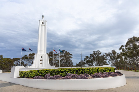 Albury war memorial is a monument in the form of a tapered lighthouse painted stark white and surmounted by a torch. Tourist attraction in Albury, Australia.の写真素材