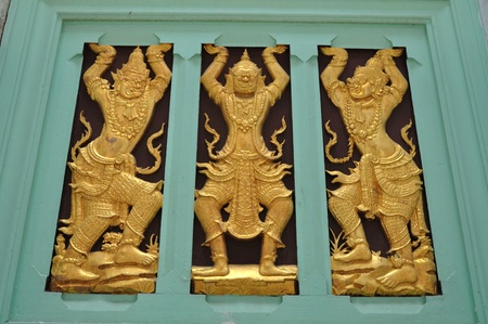 Thai art on carving wooden windowの写真素材