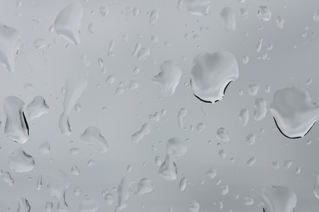 glass surface with water dropの写真素材