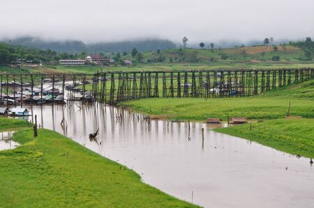Longest wood bridge in the world, it is located at Sangklaburi, Karnchanaburi, Thailand.の写真素材