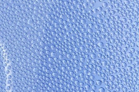 water drop on transparent blue backgroundの写真素材