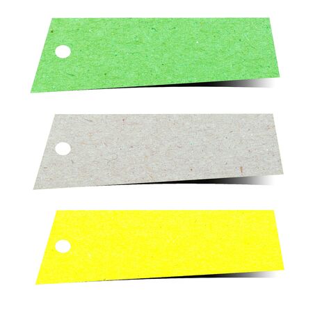 Sticky note tag made of recycled paper stick on white backgroundの写真素材