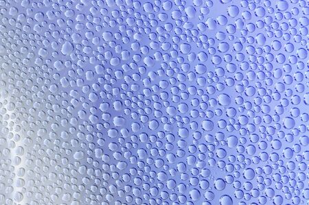 Background of water drop on transparent surfaceの写真素材