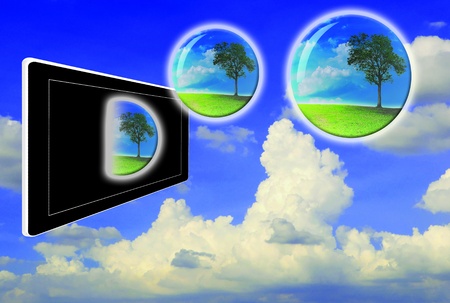 Crystal ball with lonely tree fly from touch pad or tabletの写真素材