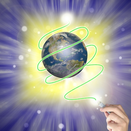 Male hand draw earth globe with tree on abstract background as conceptual image.の写真素材