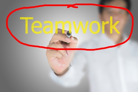 Business man write Teamwork on touch screenの写真素材