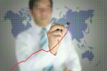 Business man write graph on touch screen displayの写真素材