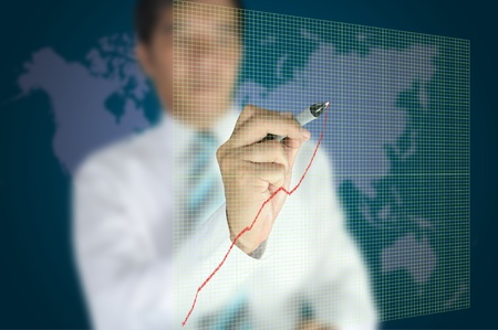 Business man write graph on touch screen displayの写真素材