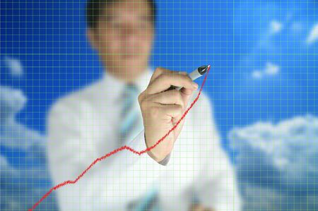 Business man write graph on touch screen displayの写真素材