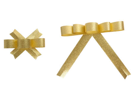 gold ribbon bow isolated on white, clipping path includedの写真素材