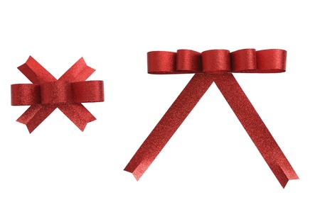 Red ribbon bow isolated on white, clipping path included の写真素材