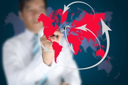 Business man write global network or globalization concept on touch screenの写真素材