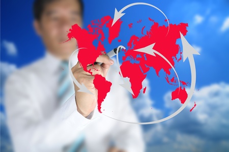 Business man write global network or globalization concept on touch screenの写真素材