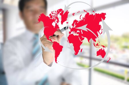 Business man write global network or globalization concept on touch screenの写真素材