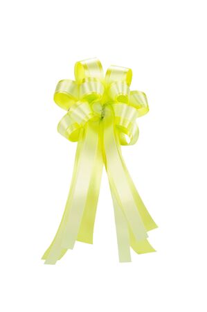 Yellow ribbon bow isolated on white, clipping path includedの写真素材