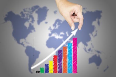 Male hand and business graph growingの写真素材