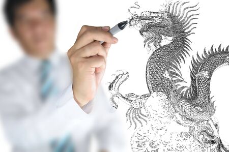 Business man draw chinese dragon の写真素材