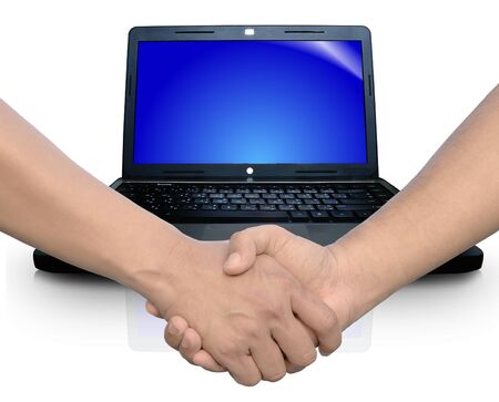 Computer notebook with handshakeの写真素材