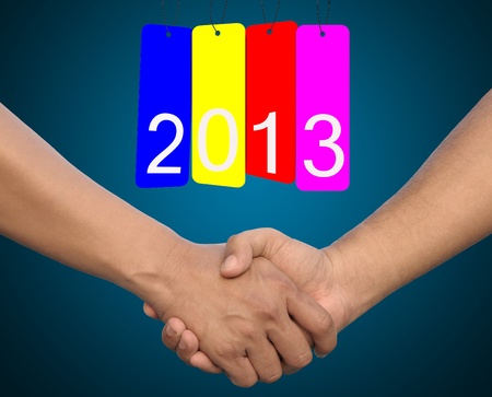hand in Hand or handshake and happy new year 2013の写真素材