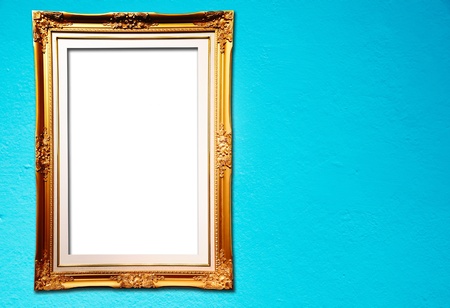 Blank golden frame on blue cement wallの写真素材