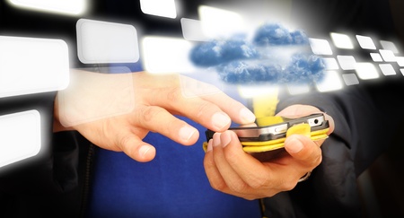 Hand of business man touch screen of mobile phone present cloud computingの写真素材