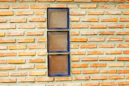 Background of Glass block on brick wall の写真素材