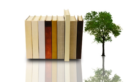 Stack of book with lonely tree on white backgroundの写真素材