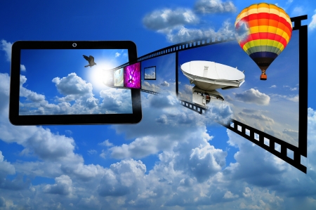 Tablet PC with Film strip and Ballon as concept of streaming 3d video on tablet の写真素材