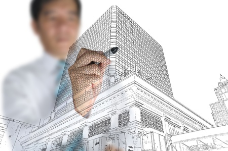 Businessman draw modern building and cityscapeの写真素材