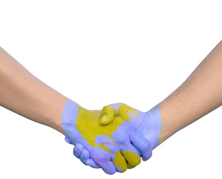 Businessmen shaking world painted hands の写真素材