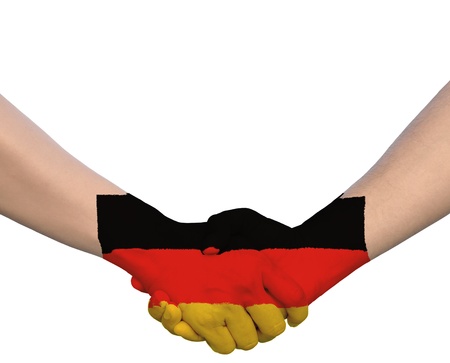 Hand in Hand of Handshake with Flag of Germanyの写真素材