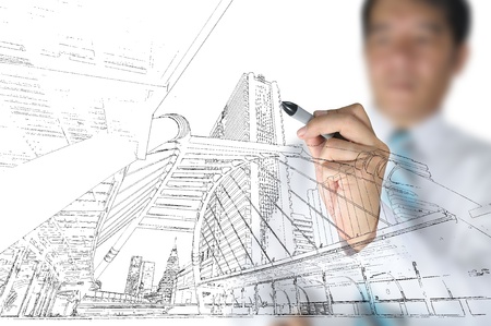 Hand of business man draw building and cityscapeの写真素材