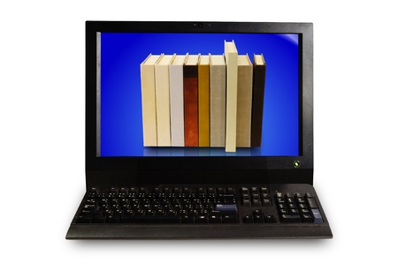 Stack of book in display of Desktop computer setの写真素材